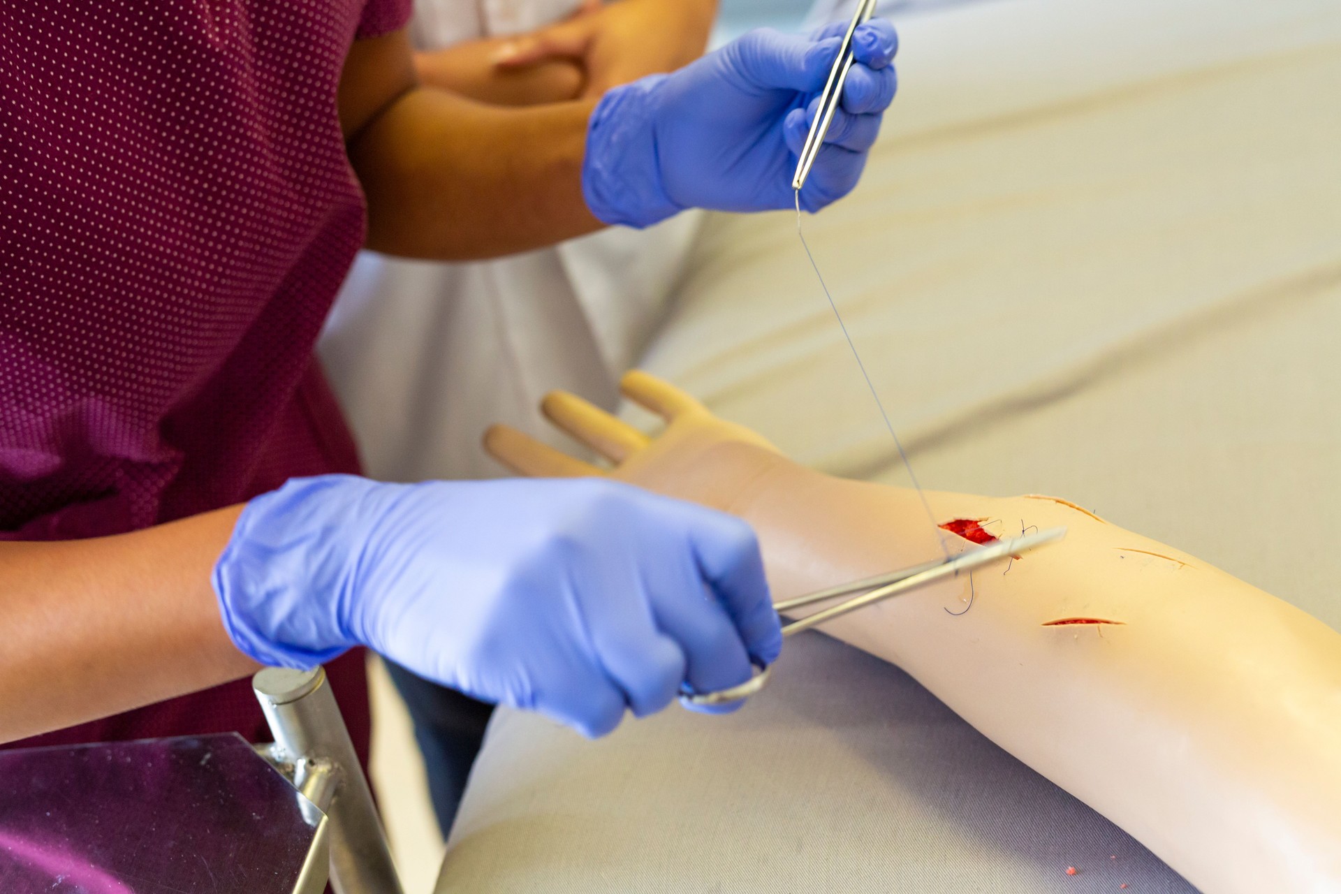 Student Doctor Practicing Medical Sutures